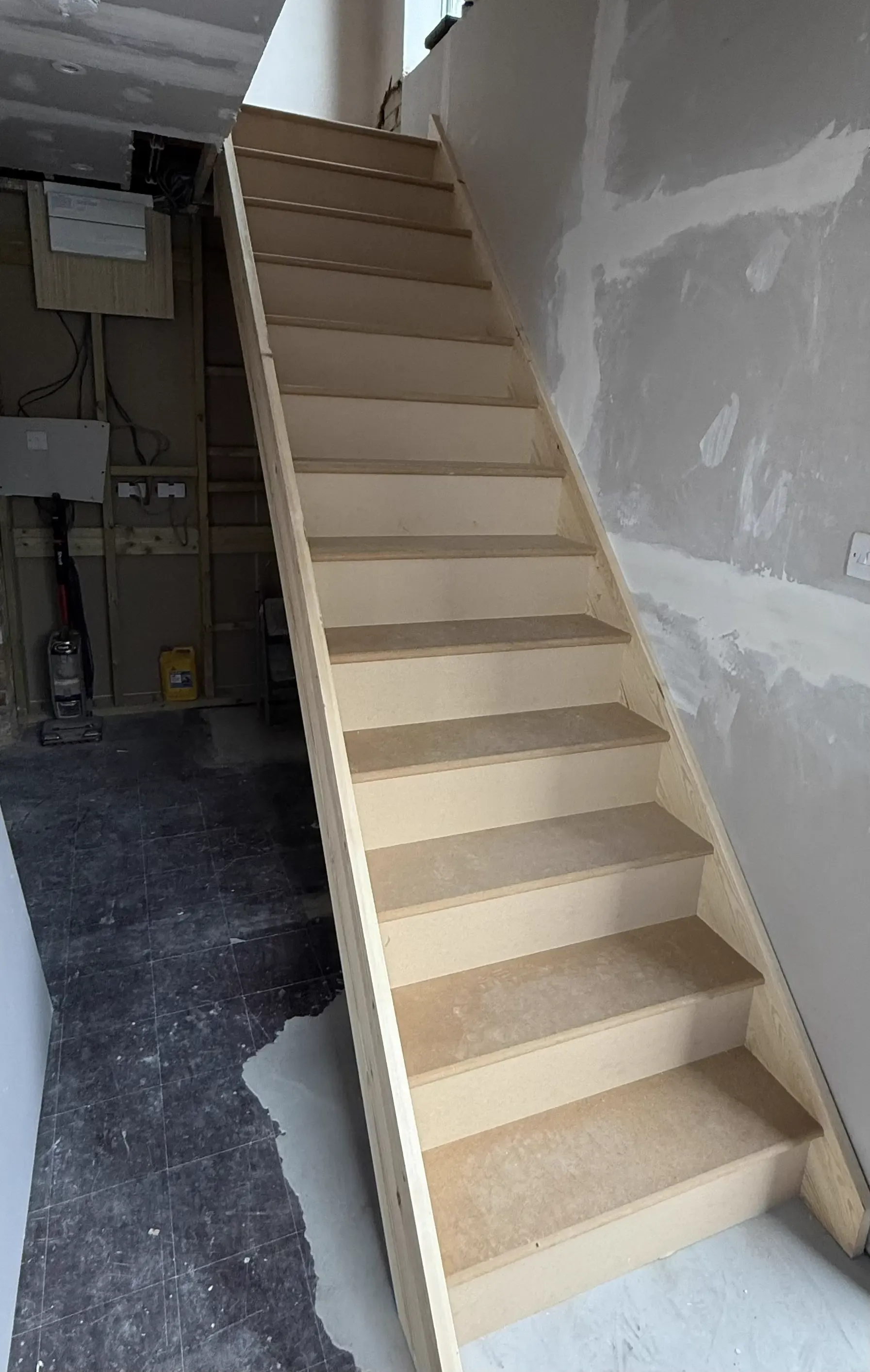 New wooden staircase installation in Kent property by expert stair builders for bespoke staircase design and renovation.