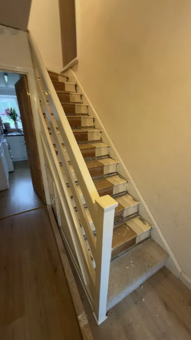 Original unsafe staircase with worn treads and old balustrade before replacement in Rainham, Kent