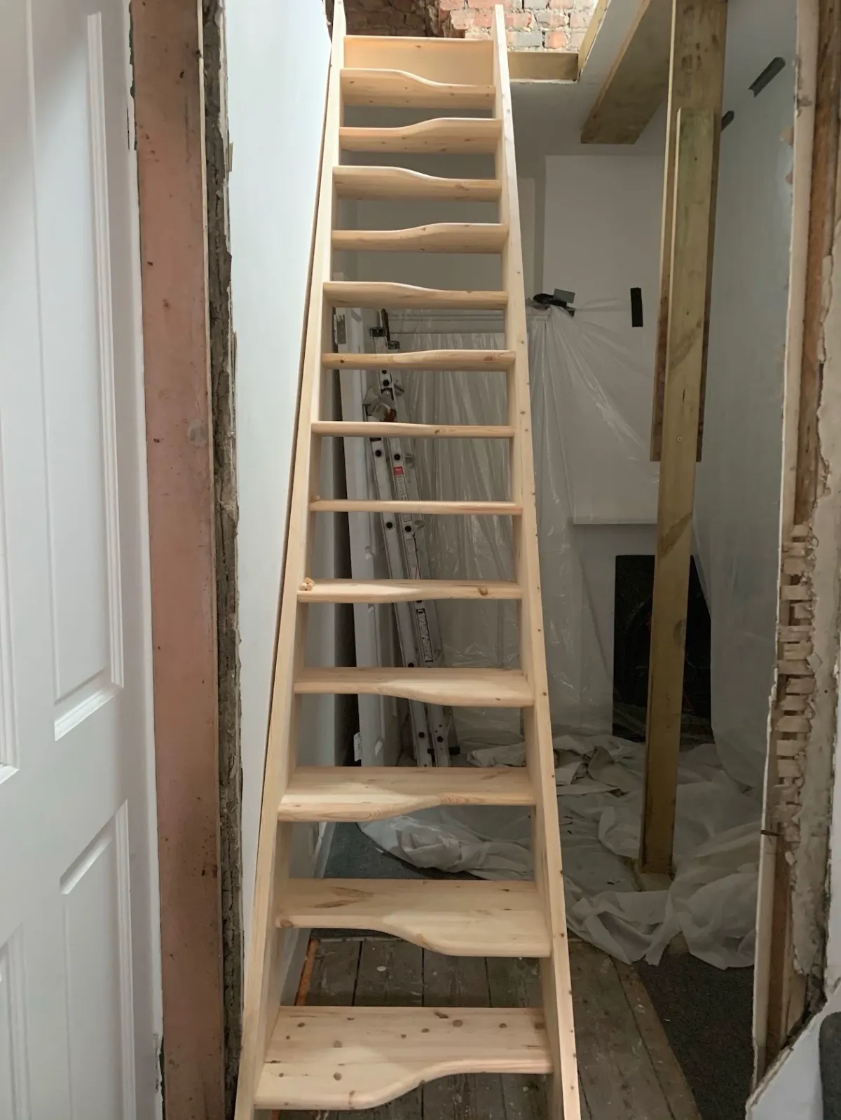 Bespoke wooden loft staircase with space-saving treads for a refurbishment project in Kent.